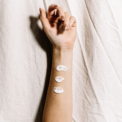 Handmade lotion on woman's arm